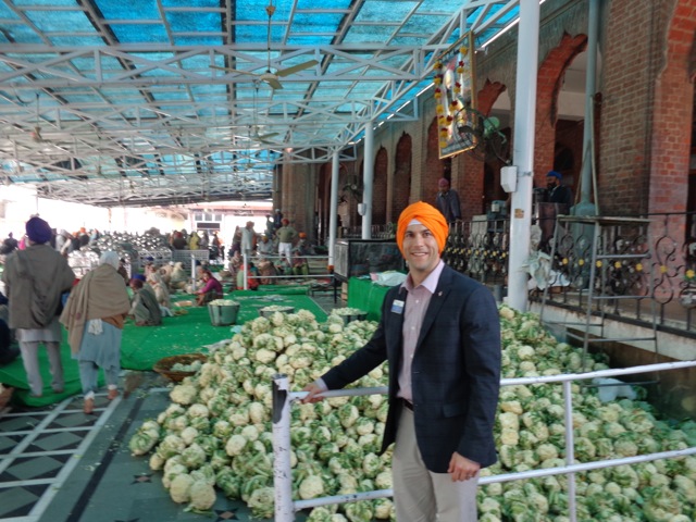 Markon’s Joe Ange examines cauliflower on his CALP trip to India