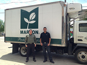 Mario Estrada, Jr. and John Galvez in front a Markon delivery truck